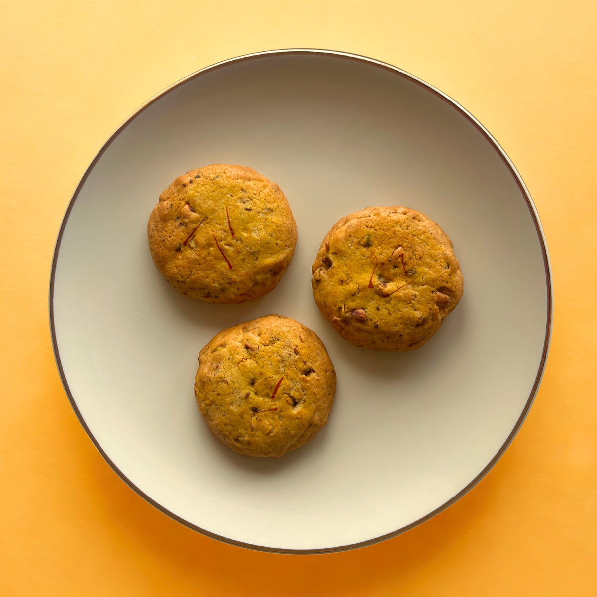 Buy Kesar Pista Cookies online in India — eggless saffron pistachio cookies with a rich aroma, freshly baked by Queen Cookies