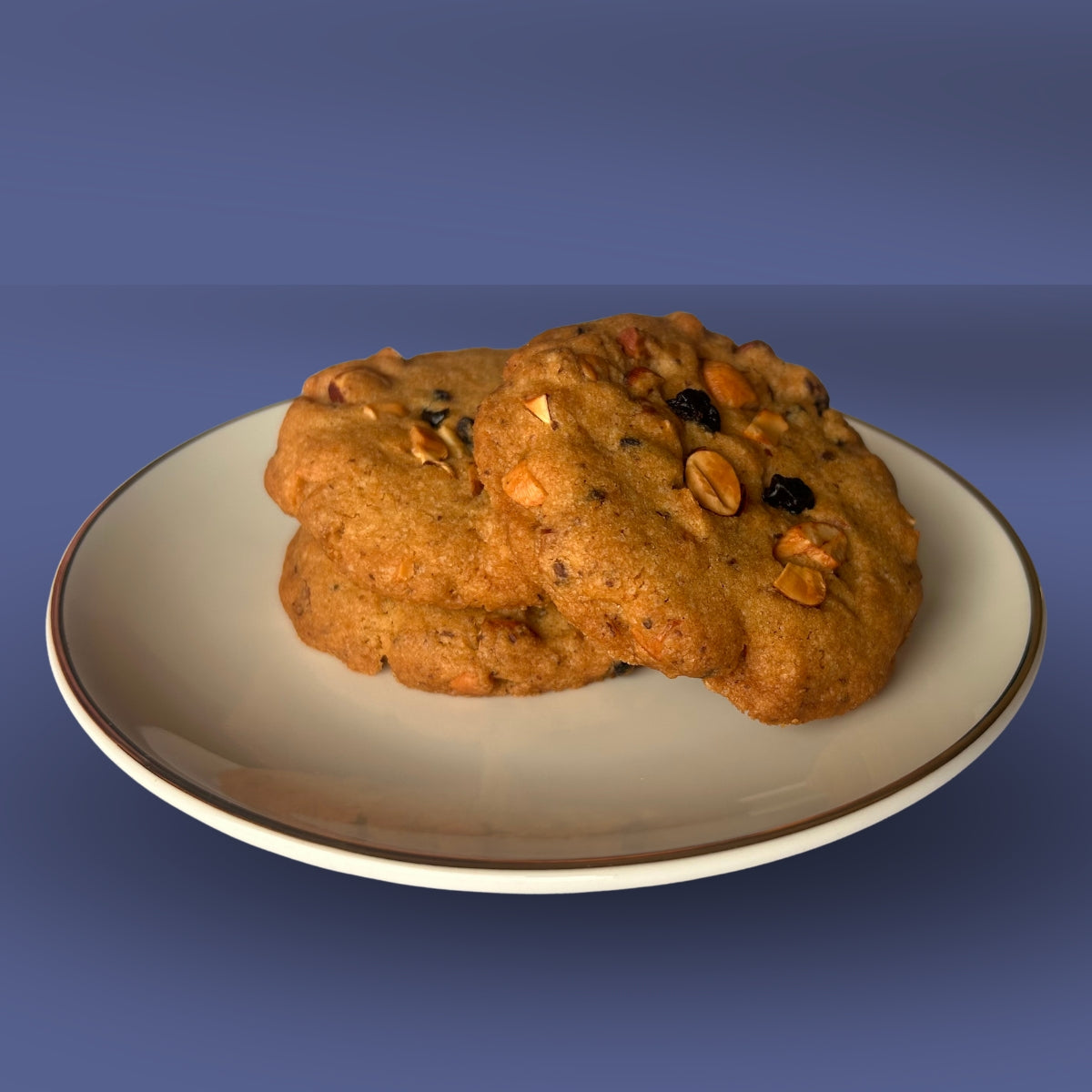 Eggless dry fruit Nuts & Berries Cookies stacked on a plate, available for online delivery across India from Queen Cookies