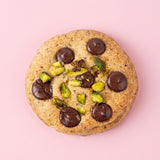 Pistachio Royale Cookie by Queen Cookies loaded with premium chocolate chips and roasted pistachios, handcrafted eggless gourmet cookie