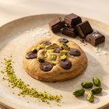 Premium Pistachio Royale Cookie topped with roasted pistachios and chocolate chips, freshly baked eggless cookie by Queen Cookies