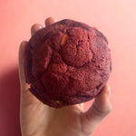 Eggless red velvet cream cheese cookie held in hand, baked by Queen Cookies, Mumbai